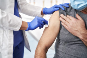 Close up of prepares a patient for vaccination Close up of prepares a patient for vaccination